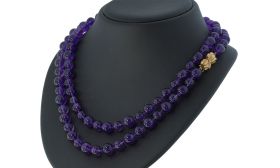 Amethist kralen collier aan 18k gouden diamant strik sluiting