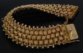 Brede gouden dames armband