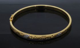 18 karaats bicolor gouden bewerkte slavenarmband 